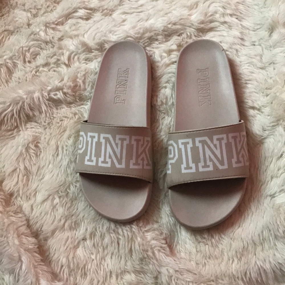 pink flip flops/ slides.